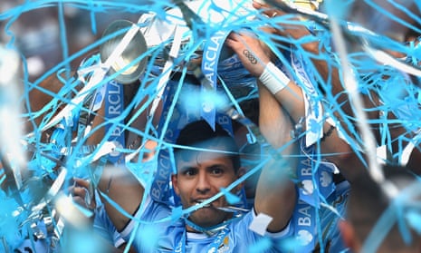 Sergio Agüero with the Premier League trophy in 2014. He is in line to win a fifth title for Manchester City this season.