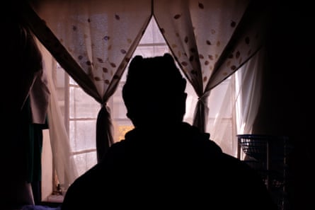 HIV-positive South African sex worker Lebo, seen in silhouette.