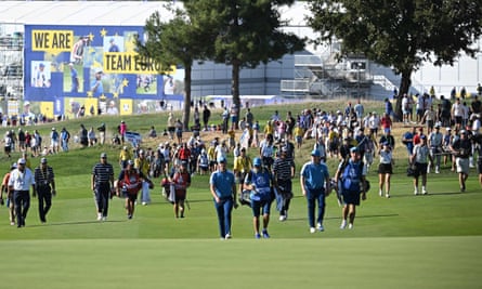 A large entourage follow the European pairing of Justin Rose and Robert MacIntyre at the Marco Simone Golf and Country Club.