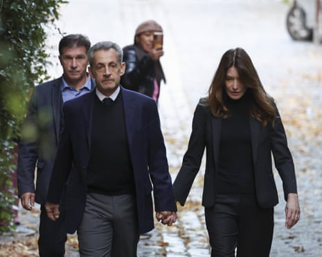 Nicolas Sarkozy, pictured with his wife, Carla Bruni, on his way to present himself at La Santé prison.