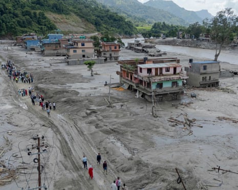 Aerial view of people walking in a flood-hit area in Nuwakot, Nepal, on Thursday