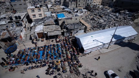 Palestinians hold first Friday prayers of Ramadan amid rubble of Gaza mosque – video
