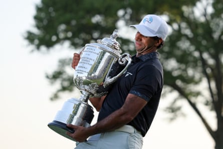 Aaron Rai celebrates with the Wanamaker Trophy after winning the 2026 PGA Championship.