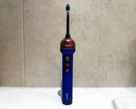 Dyson CameraJet toothbrush on a bathroom countertop, in closeup.