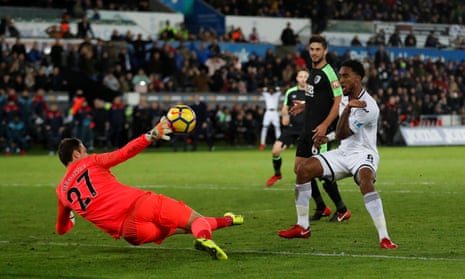 Bournemouth’s Asmir Begovic parries a goal attempt by Swansea City’s Leroy Fer