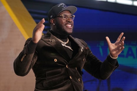 Tyler Booker celebrates after being chosen by the Dallas Cowboys.