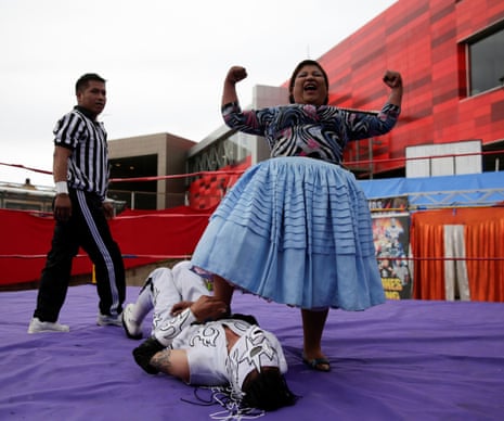 Silvana La Poderosa, a cholita wrestler, reacts after winning a fight during their return to the ring in El Alto outskirts of La Paz.