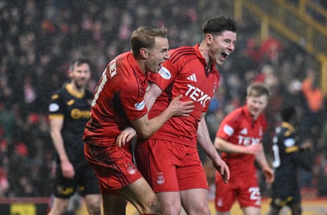 Kevin Nisbet (right) celebrates after scoring Aberdeen’s third against Livingston.