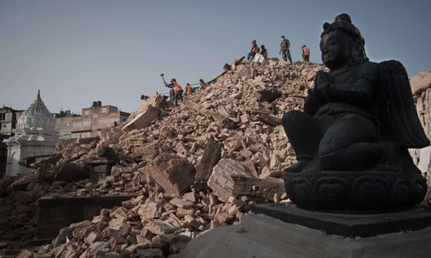 Nepalese police clear rubble at the Narayan temple in Kathmandu.