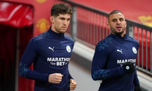 John Stones walks out for the warm up with Kyle Walker.