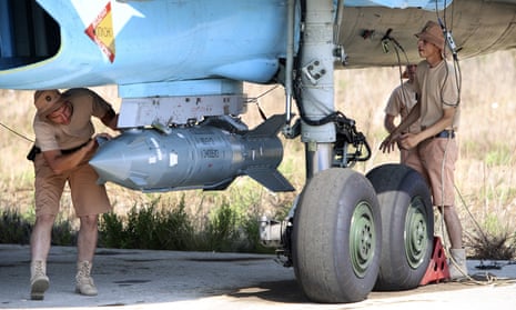 Russian military support crew attach a satellite guided bomb to SU-34 jet fighter at Hmeimim airbase in Syria. 