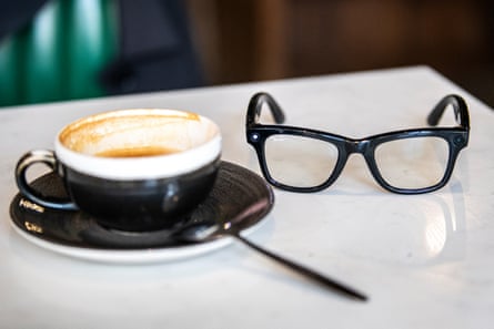 Smartglasses on a cafe table with a cup of coffee