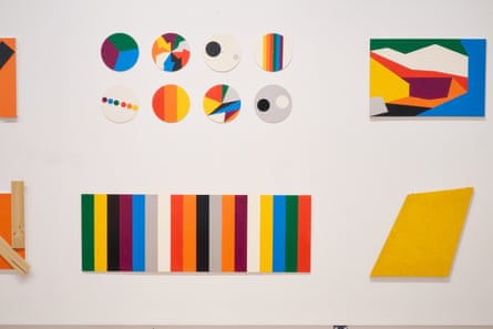 Colourful geometric paintings on gallery wall