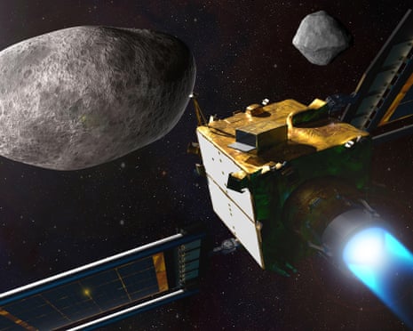 A small, box-like spacecraft approaching a large asteroid