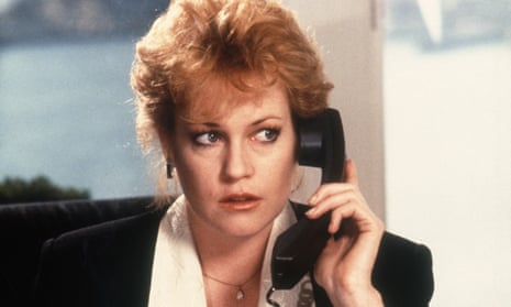 Melanie Griffith as Tess McGill, a phone to her ear, in the film Working Girl