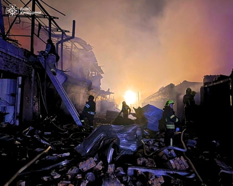 Ukrainian rescuers work to extinguish a fire at the site of an aerial attack in Bila Tserkva, Kyiv region.