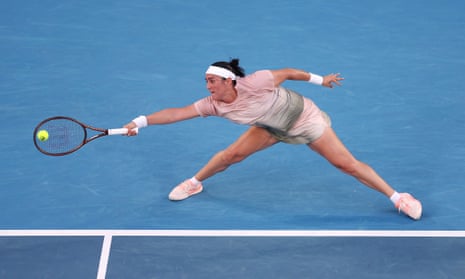 Ons Jabeur stretches to make a forehand return on the baseline during her first round singles match against Yuliia Starodubtseva during the 2024 Australian Open.