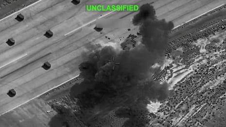 A screengrab from a video showing smoke rising from explosions at an unknown location.