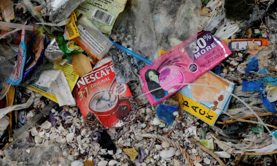 Sachets visible in a pile of rubbish