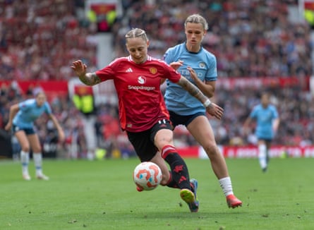 Manchester United’s Leah Galton shields the ball from Kerstin Casparij of Manchester City in May 2025