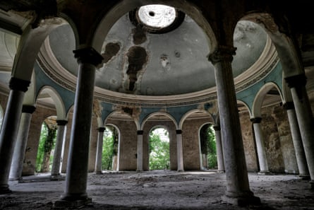 A former concert hall featuring a large dome with a small skylight and open arches stands