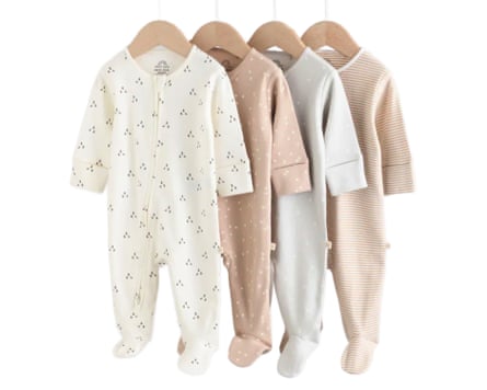 Next Cream 4 Pack Two Way Zip Baby Sleepsuits displayed with each on their own hanger.