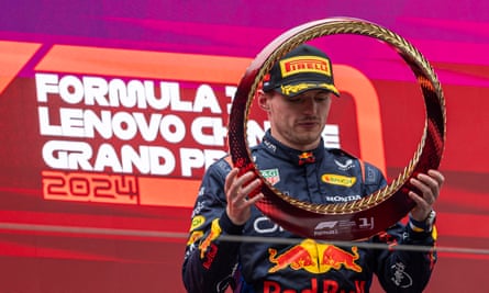 Max Verstappen celebrates on the podium after his win at the Chinese Grand Prix