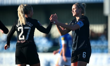 Steph Houghton (right) is congratulated by Alex Greenwood after scoring City’s third.