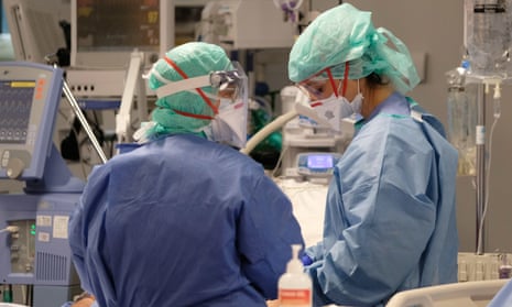 Healthcare workers take care of coronavirus sufferers in the intensive care unit of Poliambulanza hospital in Brescia, Italy.