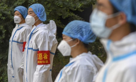 Coronavirus volunteers assemble in Urumqi, Xinjiang, as part of China’s efforts to combat the virus.