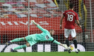West Bromwich Albion goalkeeper Sam Johnstone saves the first penalty attempt from Manchester United’s Bruno Fernandes.