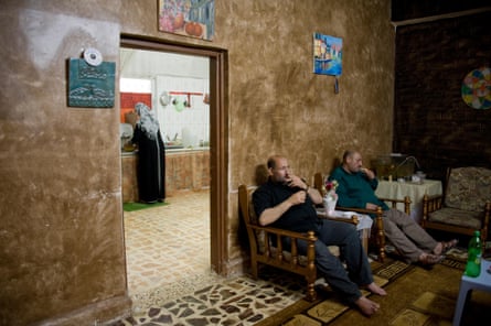 Jordanian men relax with a cigarette.