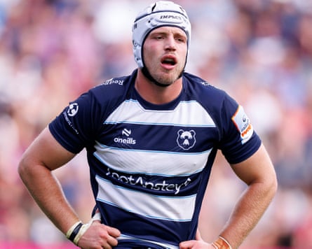 Fitz Harding of Bristol Bears in blue-and-white kit wearing a white scrum cap