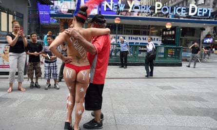 A ‘desnuda’ in body paint poses in Times Square in 2015. The controversy sparked calls to reinstate car traffic.