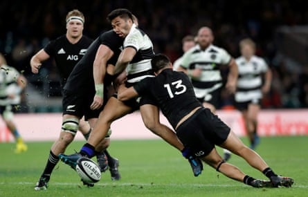 Vince Aso gets hit by a shoulder tackle from Luke Romano as Anton Leinert-Brown tackles low during the Barbarians v New Zealand rugby union match at Twickenham Stadium