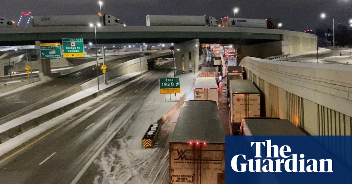 Canadian truckers block main bridge to US as Trudeau demands end to protest