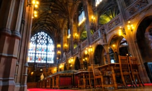 John Rylands Library interior with wood, carved stone and stained glass