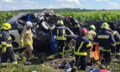 Police and rescuers work at the site where an oil truck collided with minibus in western Ukraine’s Rivne region