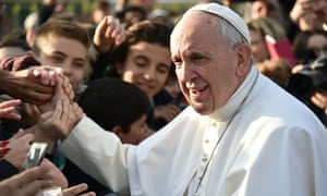 Pope Francis shakes hands during a visit to the Roman Parish of Santa Maddalena di Canossa