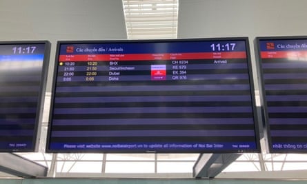 The arrivals board in Hanoi airport shows the arrival of the flight from Birmingham, UK.