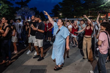 Georgians attend a concert in Mtatsminda Park.