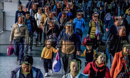 Monitors display a video showing facial recognition software in use at the headquarters of the artificial intelligence company Megvii, in Beijing.