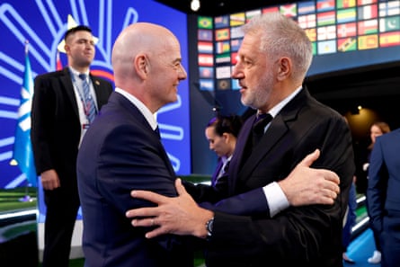 Gianni Infantino and Fifpro’s Sergio Marchi share an awkward embrace.