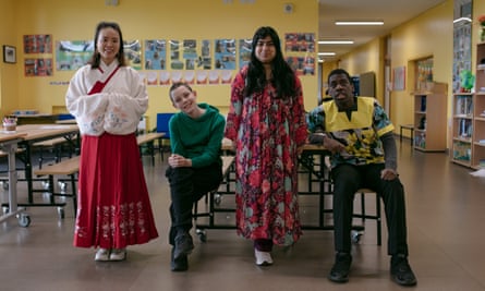 A teacher and three students during a school’s anti-racism week
