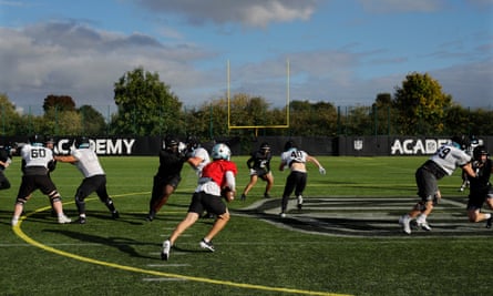 Michael Szabo, the starting quarter-back from Austria, runs with the ball during a training session for the NFL Academy at Loughborough University.