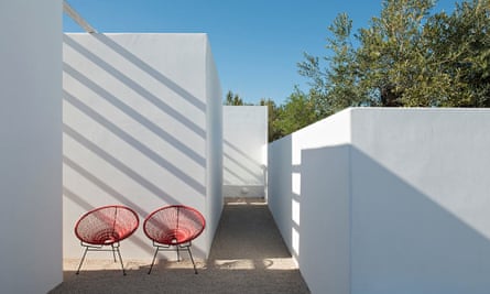 Two red  chairs and white walls at the Pensao Agricola in the Algarve