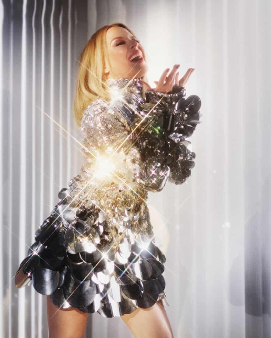 Kylie Minogue in a silver sequin mini dress. Stylist: Karl Willett. Hair and makeup: Christian Vermaak. Manicurist: Adam Slee. Set design: Paulina Piipponen. Stylist’s assistant: Adele Pentland. Dress by Christian Cowan.