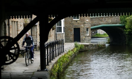 A cyclist on the Leeds-Liverpool canal towpath.