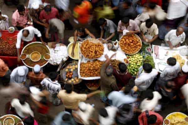 Bangladesh street vendors sell different foods on the first day of the Muslim holy month of Ramadan at Chawkbazar in Dhaka.