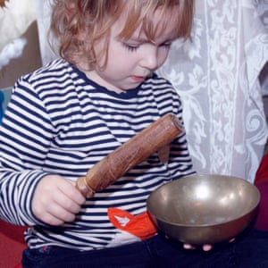 A Dharma nursery school pupil with mindfulness bell.
